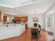 Eat-in kitchen featuring wooden cabinets, stainless steel appliances, and a breakfast bar with a view to the dining area at 1109 Woodwinds Dr, Waxhaw, NC 28173