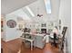 Spacious living room with vaulted ceilings, skylights, fireplace, and an open layout to the kitchen at 1109 Woodwinds Dr, Waxhaw, NC 28173