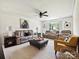 Spacious living room with a ceiling fan and lots of seating at 1109 Woodwinds Dr, Waxhaw, NC 28173