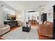 Comfortable living room adjacent to the dining room featuring a television and neutral decor at 1109 Woodwinds Dr, Waxhaw, NC 28173