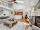 Spacious living room with vaulted ceilings, fireplace, and an open layout to the kitchen at 1109 Woodwinds Dr, Waxhaw, NC 28173