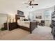 Cozy main bedroom featuring a large bed, neutral decor, and a ceiling fan at 1109 Woodwinds Dr, Waxhaw, NC 28173
