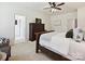 Comfortable main bedroom with a large chest of drawers and a view to the ensuite bathroom at 1109 Woodwinds Dr, Waxhaw, NC 28173