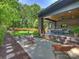 Spacious backyard featuring patio with outdoor seating and a well-manicured lawn at 112 Manning Dr, Charlotte, NC 28209