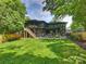 Large, landscaped backyard with a spacious lawn, perfect for outdoor activities and relaxation at 112 Manning Dr, Charlotte, NC 28209