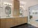 Elegant bathroom with wood cabinets, dual sinks, and modern fixtures, creating a luxurious space at 112 Manning Dr, Charlotte, NC 28209