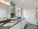 Bathroom with dual sinks, granite countertop, and stylish fixtures at 112 Manning Dr, Charlotte, NC 28209