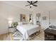 Bedroom featuring a neutral color scheme, a ceiling fan, and ensuite bathroom access at 112 Manning Dr, Charlotte, NC 28209