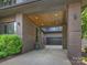 Carport with a wooden ceiling, brick pillars and a paved driveway that provides ample parking space at 112 Manning Dr, Charlotte, NC 28209
