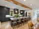 Modern kitchen features a large center island with bar stool seating and pendant lighting at 112 Manning Dr, Charlotte, NC 28209
