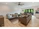 Spacious living room featuring a unique textured wall, stylish furniture, and plenty of natural light at 112 Manning Dr, Charlotte, NC 28209