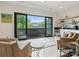 Bright living room with access to balcony offering serene views at 112 Manning Dr, Charlotte, NC 28209