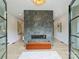 Modern living room featuring a striking stone fireplace and light wood floors at 112 Manning Dr, Charlotte, NC 28209