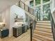 Staircase with wood treads, black metal railings and two wine fridges at 112 Manning Dr, Charlotte, NC 28209