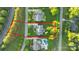 Aerial view of the property with well-maintained landscaping, pool, and surrounding neighborhood at 118 Tuscany Trl, Mooresville, NC 28117