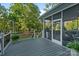 Inviting back deck with screened in porch, overlooking a lush backyard at 118 Tuscany Trl, Mooresville, NC 28117