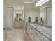 Luxurious primary bathroom with dual vanities, granite countertops, and ample cabinet space at 118 Tuscany Trl, Mooresville, NC 28117