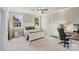This bedroom offers natural light with a comfortable bed and decor, providing a calm and relaxing space at 118 Tuscany Trl, Mooresville, NC 28117
