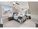 This bedroom offers large windows, decor and modern fan providing a calm and relaxing space at 118 Tuscany Trl, Mooresville, NC 28117