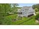 Stunning exterior view of home showing the deck, beautifully landscaped yard, and fence surrounding the property at 118 Tuscany Trl, Mooresville, NC 28117