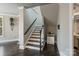 Inviting foyer with hardwood floors, staircase, and neutral paint, creating a welcoming entrance at 118 Tuscany Trl, Mooresville, NC 28117