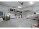 A well-organized garage with epoxy flooring, storage cabinets, and overhead racks for maximum storage at 118 Tuscany Trl, Mooresville, NC 28117