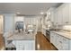 Bright kitchen features stainless appliances, a granite island with seating, and ample counter space at 118 Tuscany Trl, Mooresville, NC 28117