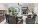 Comfortable living room features a stone fireplace, large windows, and built-in shelving, perfect for relaxation at 118 Tuscany Trl, Mooresville, NC 28117