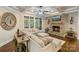 Cozy living room with a stone fireplace and large windows offering ample natural light at 118 Tuscany Trl, Mooresville, NC 28117