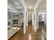 Cozy living room with stone fireplace, coffered ceiling, and hardwood floors creating an inviting space at 118 Tuscany Trl, Mooresville, NC 28117