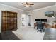 Office with desk, shelving and open door leading to bathroom, perfect setup for remote work at 118 Tuscany Trl, Mooresville, NC 28117