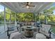 Comfortable screened porch with a circular seating area and a view of the surrounding trees at 118 Tuscany Trl, Mooresville, NC 28117