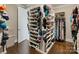 Rotating shelving in this organized walk-in closet offering ample space for shoes, clothes, and storage at 118 Tuscany Trl, Mooresville, NC 28117