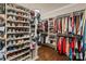Spacious walk-in closet with custom shelving and storage solutions for shoes, clothes, and accessories at 118 Tuscany Trl, Mooresville, NC 28117