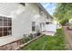 Backyard includes green grass, a white fence, and an air conditioning unit at 121 Quality Dr, Mount Holly, NC 28120