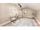 This sunlit bedroom features hardwood floors, ceiling fan, and decorative painting at 121 Quality Dr, Mount Holly, NC 28120