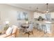 Cozy dining area with modern pendant lighting and a view into the kitchen at 121 Quality Dr, Mount Holly, NC 28120
