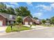 Charming brick townhomes feature attached garages, manicured lawns, and welcoming curb appeal at 121 Quality Dr, Mount Holly, NC 28120