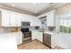 Modern kitchen with white cabinets, stainless steel appliances, and sleek countertops at 121 Quality Dr, Mount Holly, NC 28120