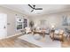 Cozy living room with neutral walls, a ceiling fan, and plenty of natural light at 121 Quality Dr, Mount Holly, NC 28120