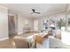 Bright living room featuring light-colored walls, wood floors, and staircase at 121 Quality Dr, Mount Holly, NC 28120