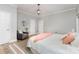 Comfortable main bedroom showcasing hardwood floors, a decorative light fixture, and views of the natural light at 121 Quality Dr, Mount Holly, NC 28120