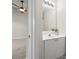Bathroom features a white sink vanity with updated light fixture above at 1305 Dan Dr, Rock Hill, SC 29732