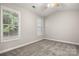 Bright bedroom with soft carpet, vaulted ceiling and large windows offering a peaceful retreat at 1305 Dan Dr, Rock Hill, SC 29732