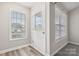 Bright entryway featuring a stylish front door with glass detailing and updated flooring and fresh paint at 1305 Dan Dr, Rock Hill, SC 29732