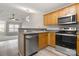 Well-equipped kitchen featuring stainless steel appliances, updated countertops, and a view to the living area at 1305 Dan Dr, Rock Hill, SC 29732