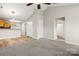 Open living space with vaulted ceiling, neutral paint, access to kitchen and bathroom offering comfortable living at 1305 Dan Dr, Rock Hill, SC 29732