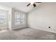 Cozy room with carpet, large windows, and vaulted ceiling, providing plenty of natural light at 1305 Dan Dr, Rock Hill, SC 29732