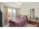 Bright bedroom with natural light, soft curtains, and tasteful decor at 13327 Savaine St, Charlotte, NC 28278