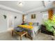 Bright bedroom featuring a decorative tray ceiling, large window, and yellow accents at 13327 Savaine St, Charlotte, NC 28278